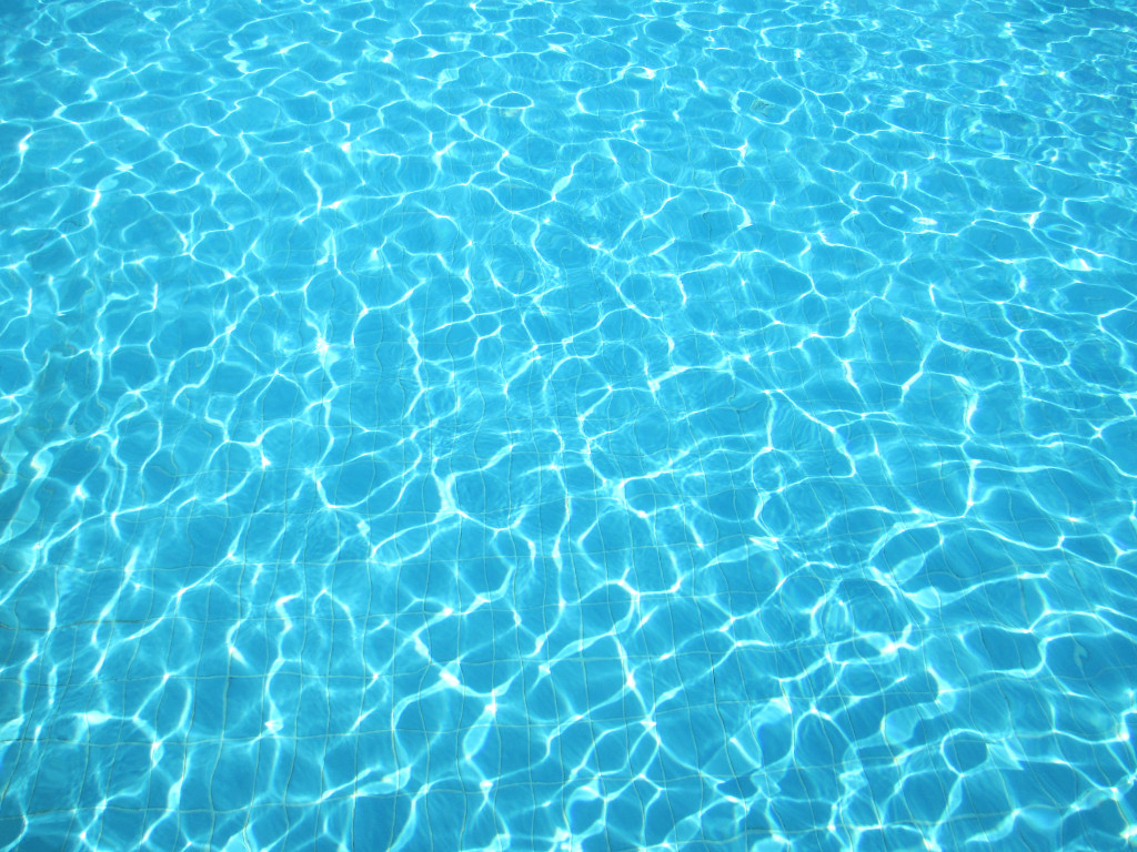 Clear blue water in swimming pool